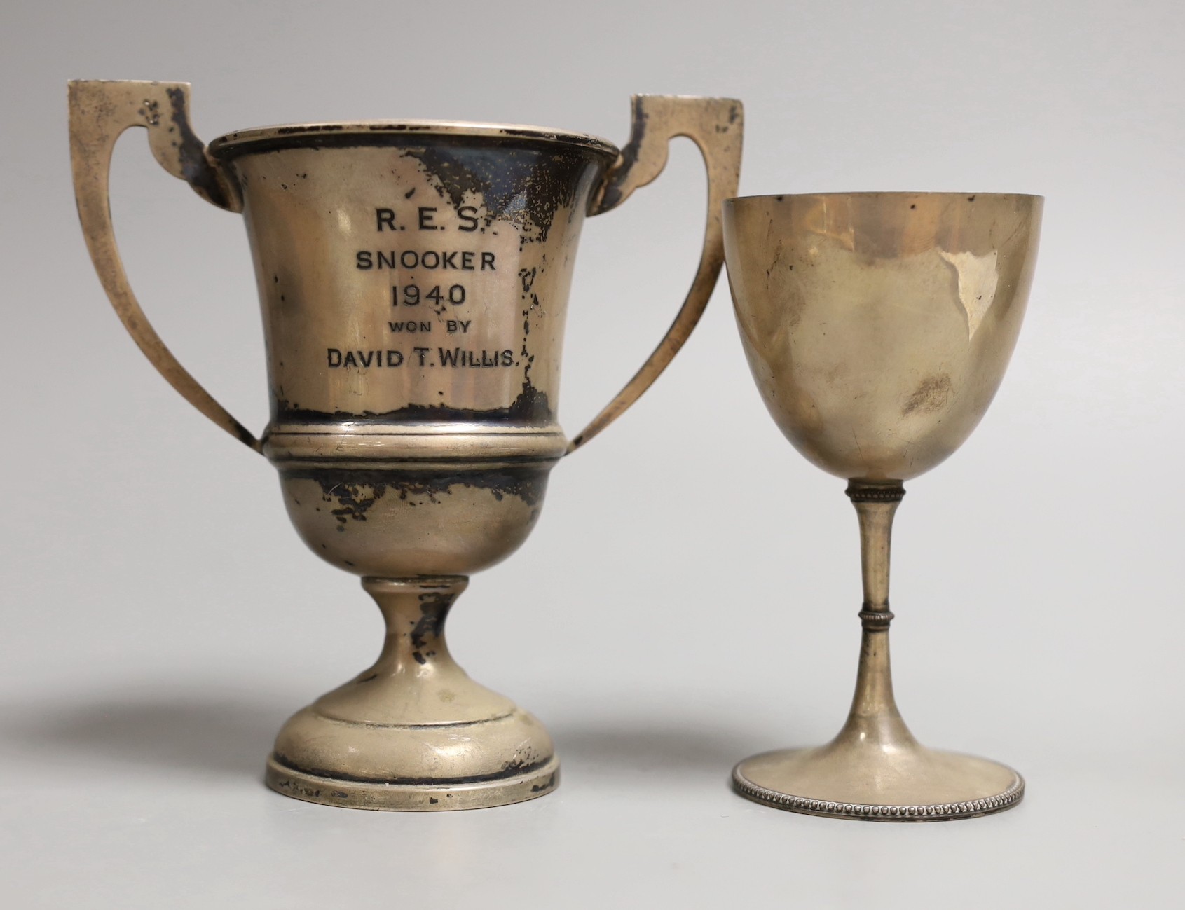 A Victorian silver goblet, by Daniel & Charles Houle, London, 1869, 11.5cm and a later two handled small cup, 6.1oz.